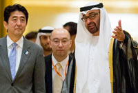 General Shaikh Mohamed bin Zayed Al Nahyan Crown Prince of Abu Dhabi Deputy Supreme Commander of the UAE Armed Forces (R), receives Shinzo Abe Prime Minister of Japan (L), prior to a state dinner at Emirates Palace. -Wam